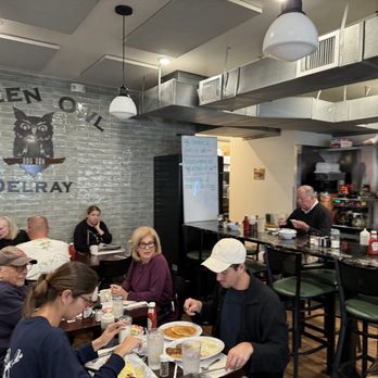 Green Owl Restaurant - diners sitting at tables eating food - Breakfast & Brunch Near Me - Delray Beach, Florida Green Owl Restaurant - diners sitting at tables eating food - Breakfast & Brunch Near Me - Delray Beach, Florida