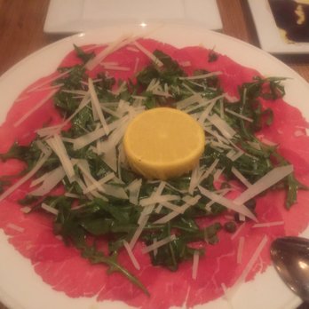 Quattro Caffe - Carpaccio Di Manzo (Thinly Sliced Filet Mignon, Arugula, Fresh Parmigiano, Capers and Truffle Oil)! - Italian Near Me - Costa Mesa, California
