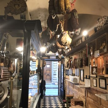 La Prosciutteria - Taken from a table inside looking out. That's meat on the ceiling! - Tuscan Near Me - Florence, FI