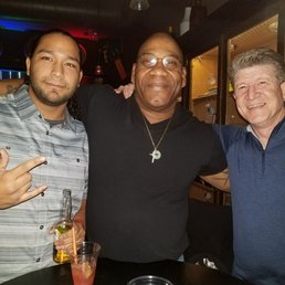 three men posing for a picture