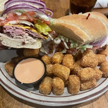 Burger N Brew - a sandwich and tater tots on a plate - Burgers Near Me - Boise, Idaho