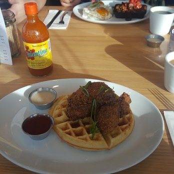 The Bro'Kin Yolk - Chicken & Waffles - HOMEMADE BELGIAN WAFFLE, SPICED FRIED CHICKEN, SERVED WITH MAPLE HONEY HOT SAUCE AND WHITE CHICKEN GRAVY - Breakfast & Brunch Near Me - Calgary, Alberta