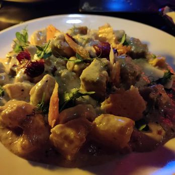 Noir Dark Spirits - The online menu isn't updated, forgot the name but this is a butternut squash gnocchi pork belly dish with cream sauce, sage, and cranberry. - American Near Me - Scranton, Pennsylvania