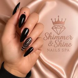 MKJ Nails - Glossy black stiletto nails with bold statement artistry and a sleek luxury finish. "