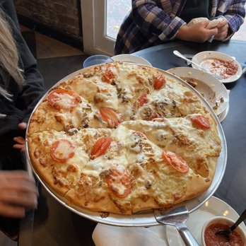Bottoms Up Pizza - Custom white sauce large pizza with chicken and tomatoes - Pizza Near Me - Richmond, Virginia Bottoms Up Pizza - Custom white sauce large pizza with chicken and tomatoes - Pizza Near Me - Richmond, Virginia