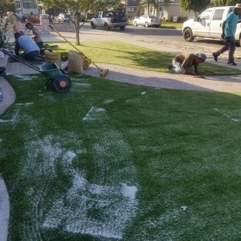 Better Green Scapes - Putting down the sand infill. - Artificial Turf Near Me