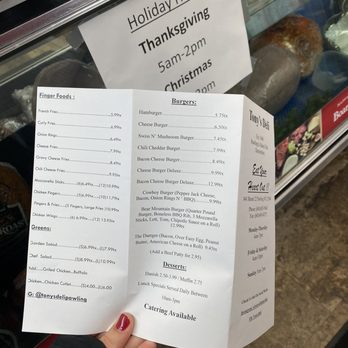 Tony's Deli - a person holding a menu - Delis Near Me - Pawling, New York Tony's Deli - a person holding a menu - Delis Near Me - Pawling, New York