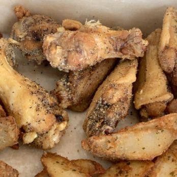 Buffalo Wild Wings - Feathers still on the wing!!! Gross!! - Sports Bars Near Me - Waco, Texas