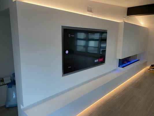 Living Room Remodel - This project required a tv to be mounted flush with the wall, to be placed over a beautiful new fire feature. Living Room Remodel - This project required a tv to be mounted flush with the wall, to be placed over a beautiful new fire feature.