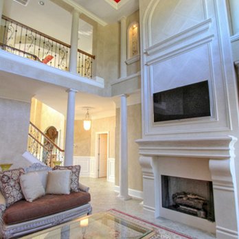 Reminiscent Homes - a large living room with a fireplace - General Contractors Near Me - Bluffton, South Carolina