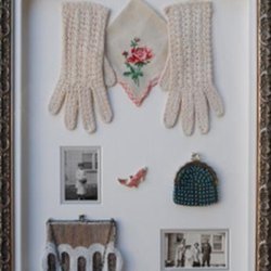 Just Framing - A collection of great-grandma's handmade purses and gloves along with wedding photos. We used a custom shadowbox frame from Larson Juhl.