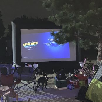SkyPark Camp + RV Resort - We set up a screen on one of our sites for a movie for the kids. - RV Parks Near Me - Skyforest, California