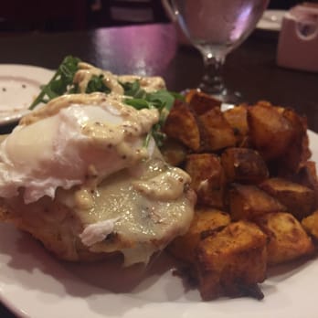 Aroma On Bryant - Sliced pork chop over a biscuit. You can substitute for a poached egg like I did! - Italian Near Me - Buffalo, New York