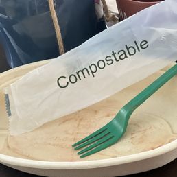 a Satisfied customer's finished acai bowl showing the mindful packaging