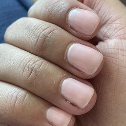Cuticles barely cut and sloppy, 5-layer polish Cuticles barely cut and sloppy, 5-layer polish