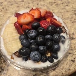 Coconut base with blueberry, banana, strawberry, granola, Nutella (missing peanut butter)