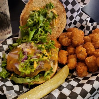 The Crooked Crow - Big Mac burger with tots - Bars Near Me - West Allis, Wisconsin