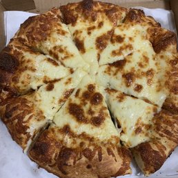 Large cheese pizza; thick crust; white garlic sauce. We love it