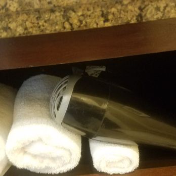 Macon Marriott City Center - Hair dryer in the bathroom, behind the clean towels. - Hotels Near Me - Macon, Georgia