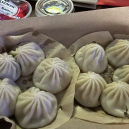 Pork dumplings and pork and shrimp dumplings. I recommend getting the Chili Crisp sauce. Pork dumplings and pork and shrimp dumplings. I recommend getting the Chili Crisp sauce.