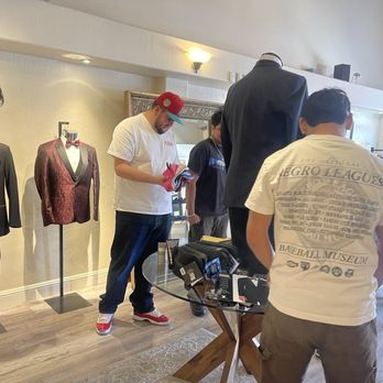 Tuxedo & Styles - The guys looking at the tuxedo options and color swatches. - Men's Clothing Near Me - Hollister, California Tuxedo & Styles - The guys looking at the tuxedo options and color swatches. - Men's Clothing Near Me - Hollister, California