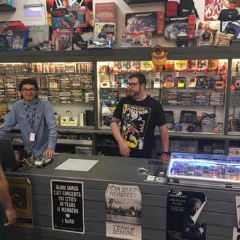 Records & Rarities - The owner, Ryan, who racially mocked and insulted me in front of my children.  To his left, an employee, who laughed at the situation. - Video Game Stores Near Me - Springfield, Virginia