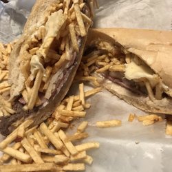 Rubido's Cafeteria - Pan con bistec, added Swiss cheese.