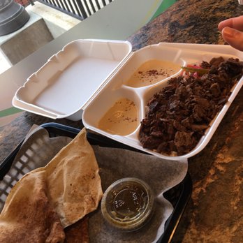 Madistan - Shawarma was on a bed of rice and greens. Excuse the floating thumb. - Mediterranean Near Me - Madison, Wisconsin