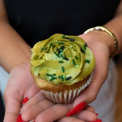 Sweet Crimes - Gluten-free matcha cupcake with silky green rosette frosting & sprinkles. Handcrafted fresh at Sweet Crimes DC's dedicated GF bakery.