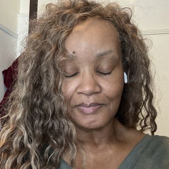 Amen African Braids - Rita Bellouze thinking about her next appt with Angel.  Photo by Ouisa (c) 2025 - Cosmetics & Beauty Supply Near Me - Chicago, Illinois