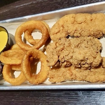 Studio Movie Grill - Chicken strip plate with side onion rings (one of the 2-person meal for $30) - Cinema Near Me - Arlington, Texas Studio Movie Grill - Chicken strip plate with side onion rings (one of the 2-person meal for $30) - Cinema Near Me - Arlington, Texas