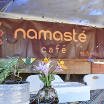 Namasté Café - a table with flowers in a vase - Coffee & Tea Near Me - Ukiah, California Namasté Café - a table with flowers in a vase - Coffee & Tea Near Me - Ukiah, California