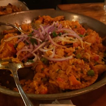 Bodegon No 69 - 4.25  Seafood paella,rice was perfectly cooked,  seafood/flavors were good, ate with the red and green sauce and pork dish we ordered. - Latin American Near Me - Pasadena, California
