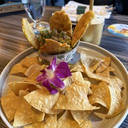 Caribbean Guacamole comes with tortilla chips and tostones ... and an orchid.