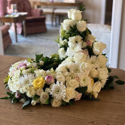 The Blossom Shop - This floral arrangement was designed to encircle an urn.