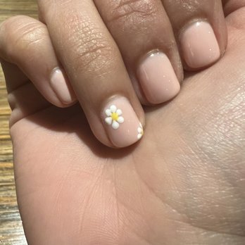 Nail Lounge By K - This is the flower the tech painted on my nail. It is uneven and nothing like the picture I showed her. - Nail Salons Near Me - Lake Mary, Florida Nail Lounge By K - This is the flower the tech painted on my nail. It is uneven and nothing like the picture I showed her. - Nail Salons Near Me - Lake Mary, Florida