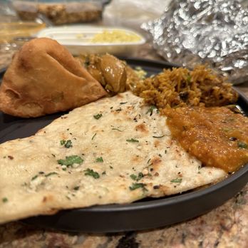 Turmeric Hut - Indian Restaurant - a plate of food on a table - Indian Near Me - Oceanside, California