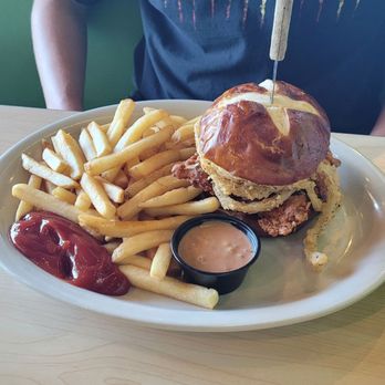 The Toasted Yolk Cafe - Fried chicken sandwich with fries - Breakfast & Brunch Near Me - Magnolia, Texas The Toasted Yolk Cafe - Fried chicken sandwich with fries - Breakfast & Brunch Near Me - Magnolia, Texas