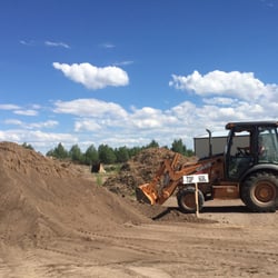 Absmeier Landscaping & Construction - Loading up with top soil. Two scoops please!