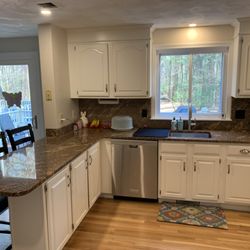 Cornerstone Tile & Marble - Kitchen with older dark granite before the install of the new quartz and tile backsplash.