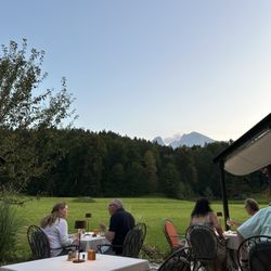 Alm- & Wellnesshotel Alpenhof - View from the outside dining area at dinner