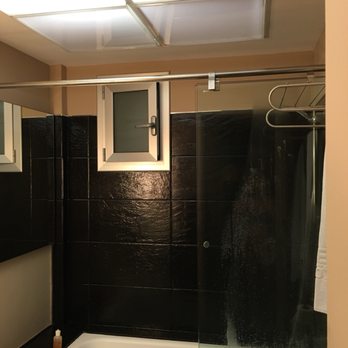 Hotel Rivoli Barcelona - Interior room where all the windows are faux frosted windows. This ones a mini window in the bathroom... - Hotels Near Me - Barcelona, B