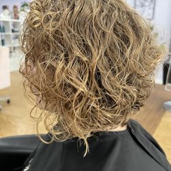 Bob layered curly haircut.