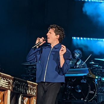 Charlie The Live Experience - a man singing on stage - Music Venues Near Me Charlie The Live Experience - a man singing on stage - Music Venues Near Me