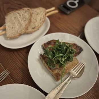 Cascina Spinasse - creselle: stuffed with prosciutto cotto + parm fonduta with arugula salad = $19 - Italian Near Me - Seattle, Washington Cascina Spinasse - creselle: stuffed with prosciutto cotto + parm fonduta with arugula salad = $19 - Italian Near Me - Seattle, Washington