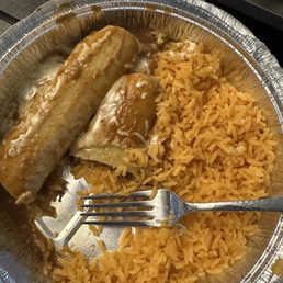 Beef enchiladas and Spanish rice in a to-go container Beef enchiladas and Spanish rice in a to-go container