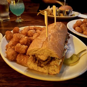 Nui Nui At Anderson School - Pele's Pulled Pork Sandwich with Cajun tots - Tiki Bars Near Me - Bothell, Washington Nui Nui At Anderson School - Pele's Pulled Pork Sandwich with Cajun tots - Tiki Bars Near Me - Bothell, Washington