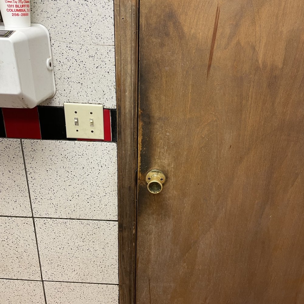 Bernie's Chicken - a dirty door and a paper towel dispenser - Coffee & Tea Near Me - Columbia, South Carolina
