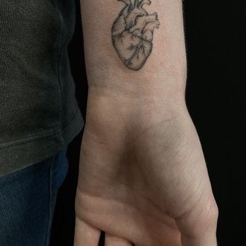 Leviticus Tattoo and Body Piercing - heart tattoo ; minimalistic tattoo ; single needle tattoo. done by Clifton - Tattoo Near Me - Minneapolis, Minnesota