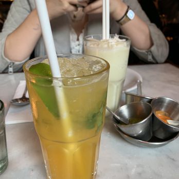 Dishoom - Aflatoon's Colada (back) & Passionfruit Sharbat (front) - Indian Near Me - London, XGL Dishoom - Aflatoon's Colada (back) & Passionfruit Sharbat (front) - Indian Near Me - London, XGL